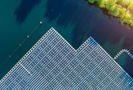 Floating solar panels platform on the beautiful lake renewable alternative electricity energy of panorama aerial viewの写真素材