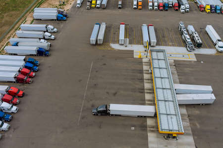 Resting place the truck stop various types of trucks in parking lot the highway with gas station for...