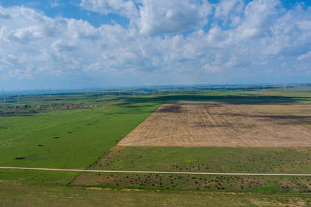 Panoramic view wind blade generators in a West Texas field of a larger wind farm