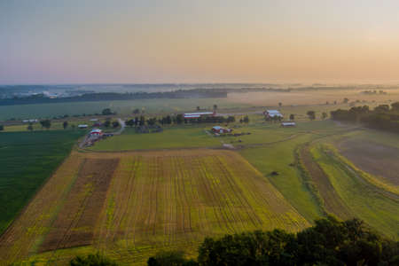 Panoramic aerial view with sunrise in early morning rural landscape nature fieldの写真素材