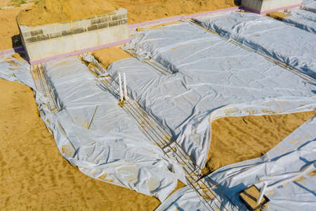 Work with drainage system of the earth for pipe sewer lying installation of a new PVC plastic pipeの写真素材