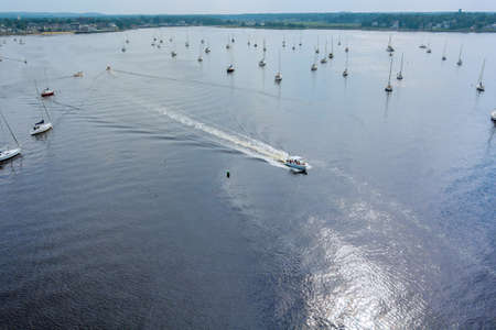 Aerial view of yacht marina sailing boats on ocean from above