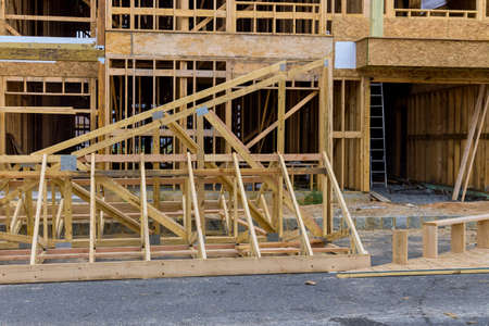 Wood building frame structure on a new development framing of new house under construction