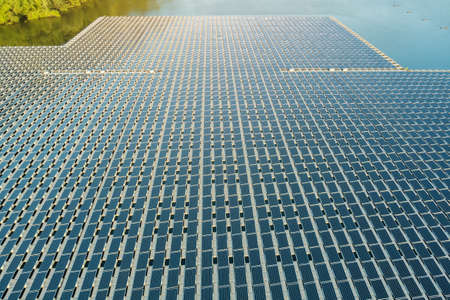 Aerial view of platform system on the lake in floating solar cell panels park floating in a blue pondの写真素材