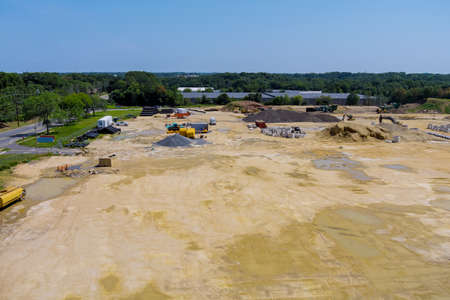 Aerial view of construction earn work in new residential buildings at work preparing ground