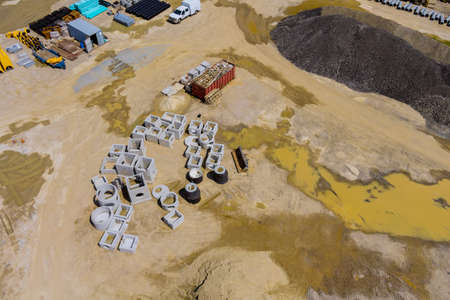 Panoramic view of work preparing ground under construction area with laying drain manholes for water systemの写真素材