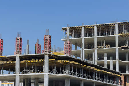 Construction of a multi storey apartment building are work along the building in progress