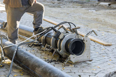 Welding the connecting of HDPE the water pipe in the reconstruction road