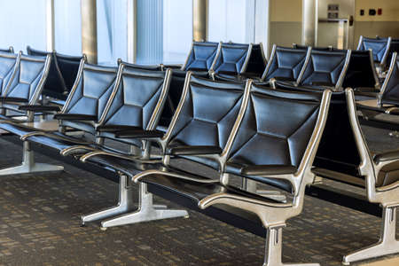 Empty terminal waiting area with seats in the departure lounge at the airport