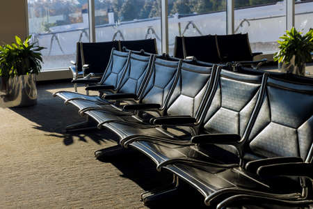 Empty passenger waiting seat departure lounge airport terminal area with chairs