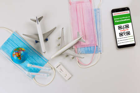 Smartphone mobile app with Coronavirus vaccination passport for international travelling in the swab sample tested positive new mutation Omicron COVID-19の写真素材