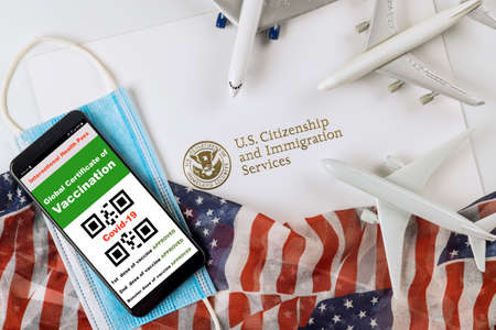 A vaccination required to sign at COVID-19 on the coronavirus immunization certificate status at the US entryの写真素材