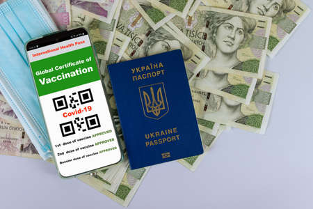 Travel to the Czech with a smartphone digital Covid-19 health passport and Ukraine passport, ceska koruna currencyの写真素材