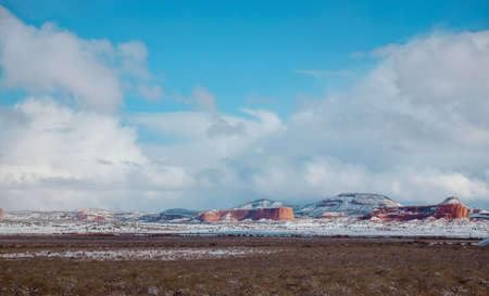 Dangerous covered roads and hazardous winter weather along a high rocky mountains I-40 road in...