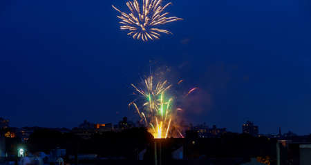 Manhattan skyline illuminated at amazing fireworks in Independence day New York City