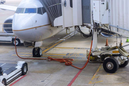 Preparation of the airplane before flight on aircraft with airport ground serviceの写真素材