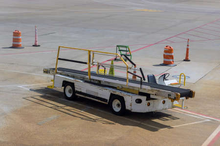 On Airport conveyor belt overhead view to airplaneの写真素材