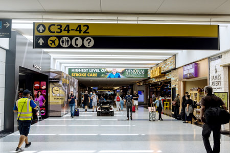 20 September 2021 Houston TX USA: Houston Intercontinental Airport IAH with passengers walking in airportのeditorial素材