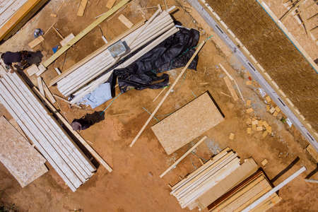 Material the construction a wooden building with stack of wooden beams for construction.の写真素材