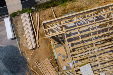 A long of installing second floor joists in a new apartment development under construction siteの写真素材