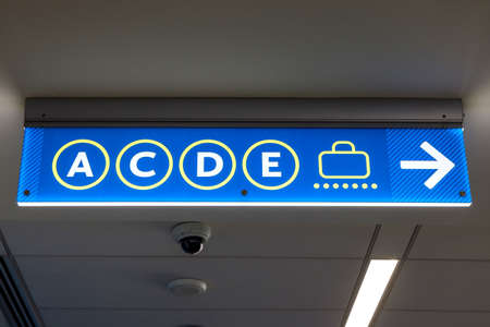 International Airport sign Gates ACDE in air terminal