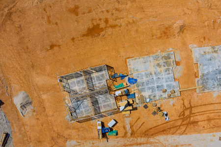 Aerial top view under construction site making foundation for a new home