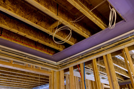 Interior view beams built frame unfinished wooden house the construction siteの写真素材