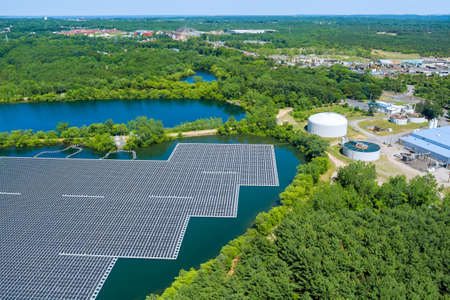 Alternative renewable energy of photovoltaics the solar power plant floating on the water in lake aerial viewの写真素材