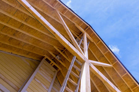 New wooden roof under construction visor the porch for houseの写真素材