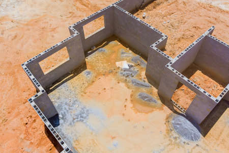 New home under construction with concrete blocks foundation an aerial view