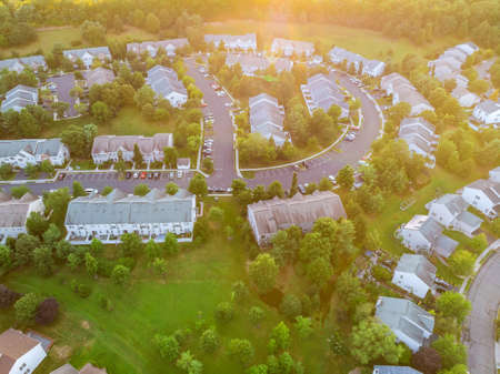 Aerial top view panorama of a small town city of residential district at suburban development with...