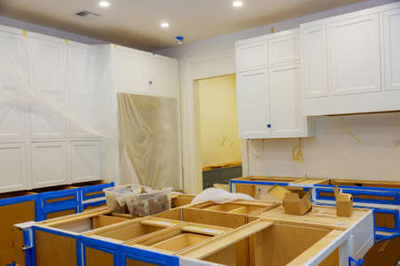 In a new house, how to install and assemble modern kitchen cabinetsの写真素材