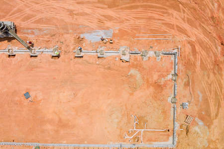 Concrete columns were poured with a concrete mixer truck to construct a new home an aerial view