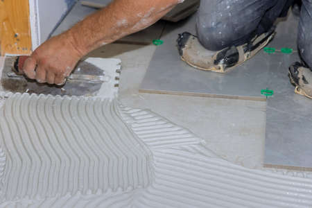 In a bathroom works, wet mortar should be spread before tiles are applied to the floor.
