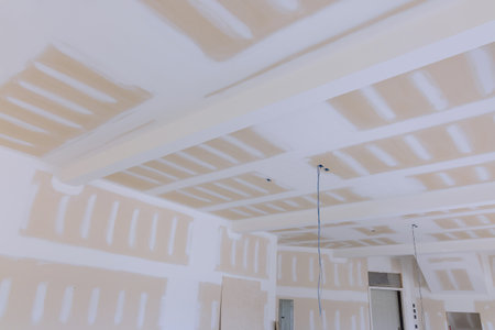 New house under construction with finishing plastering drywall in ready for paintの写真素材