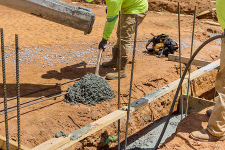 An effective method for constructing a houses foundation is to pour concrete trenches along the soilの写真素材