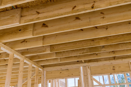 The wooden beams sticks that being used to build a new house are being installed