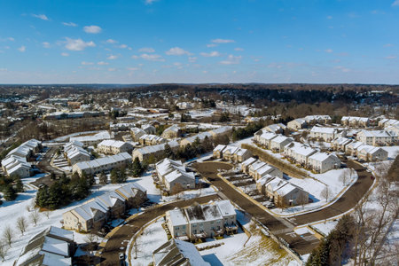 An American town in Pennsylvania has a residential complex with snowy roof after severe snowstorm has fallen on itの写真素材