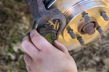 Car mechanic replacement of brake pads system the in car service centerの写真素材