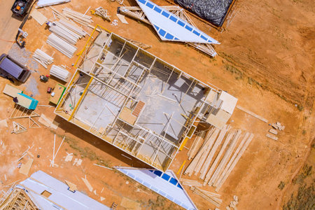 View top from an aerial perspective construction framing beam development of unfinished wooden house