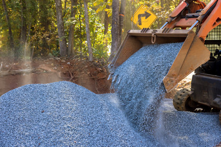 This was an bobcat loader excavator that was used to unload crushed stone during road repair work