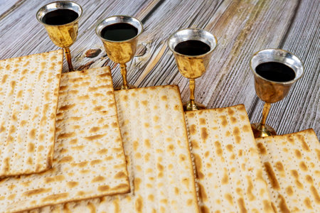 Passover matzo Jewish holiday celebration of matzah with four cups red kosher wine served during...
