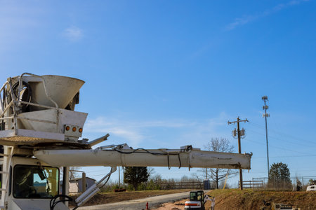 Special concrete mixing truck is delivered to construction site following outpouring of concrete mix