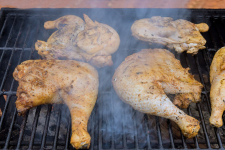 Marinated chicken before placing it on flaming charcoal grill to give rich, smoky flavor.の写真素材