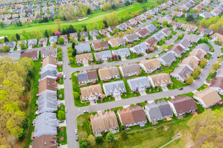 Residential area of small American town with houses and roads on aerial view.の写真素材