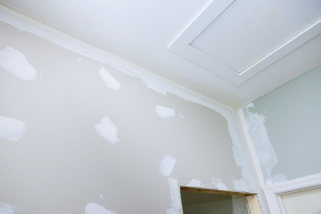 Newly constructed houses have been plastered with drywall are now prepared for paintingの写真素材