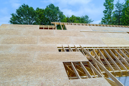 Building home with under construction framing new wooden roof plywood