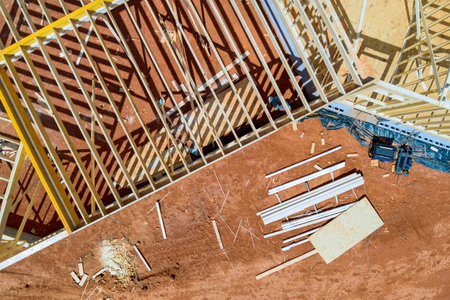 Construction site during framework new residential house with wooden framing along walls made of...