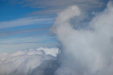 Taking look through window of an aircraft during flight in admiring beautiful blue skies day