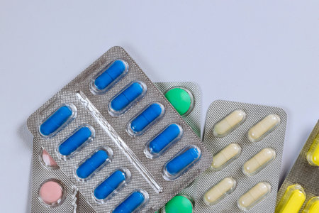 Assortment includes variety of pharmaceutical medicine blisters with colorful pills, tablets,...